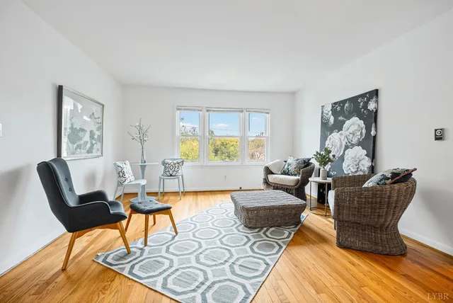 a living room with furniture and a large window