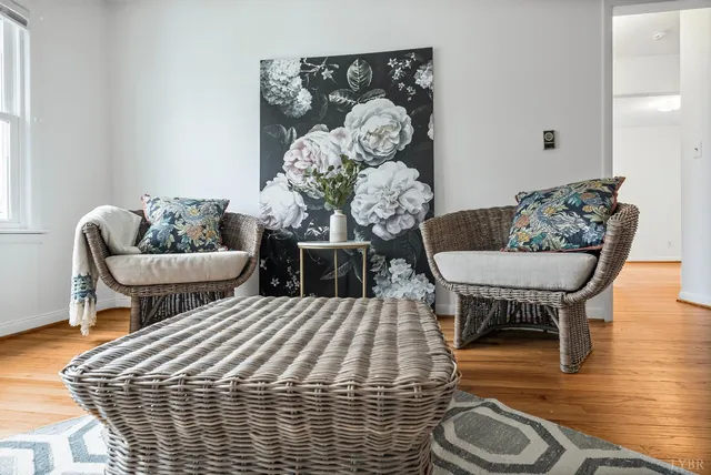 a bedroom with furniture and a wooden floor