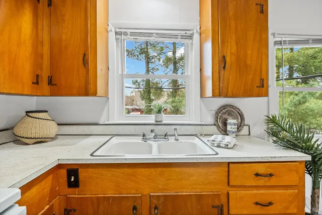 a bathroom with a sink and a window