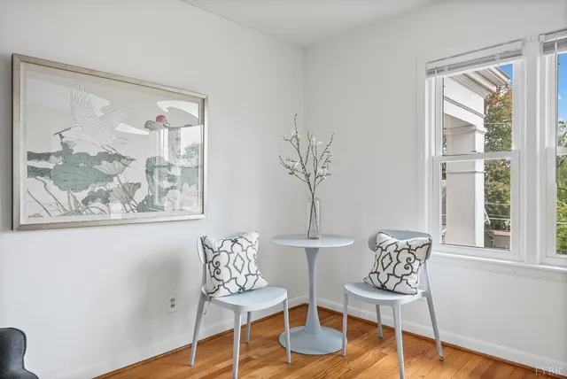 a view of a livingroom with furniture and wooden floor