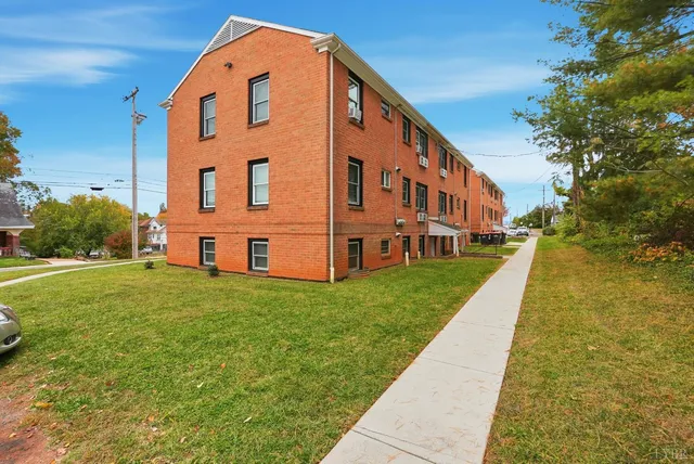 a view of building with yard