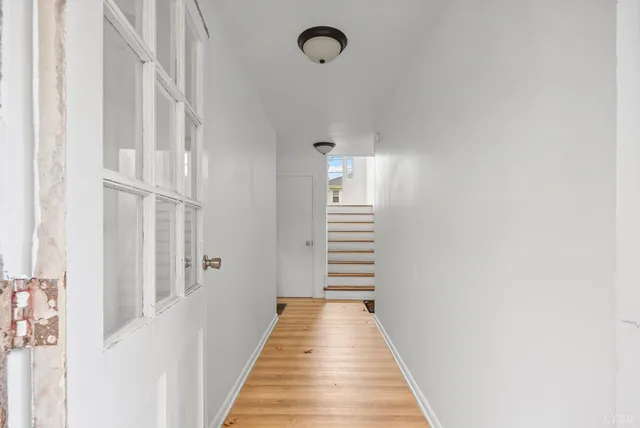 a view of a hallway with stairs