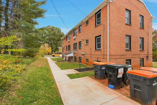 a view of a building with a yard