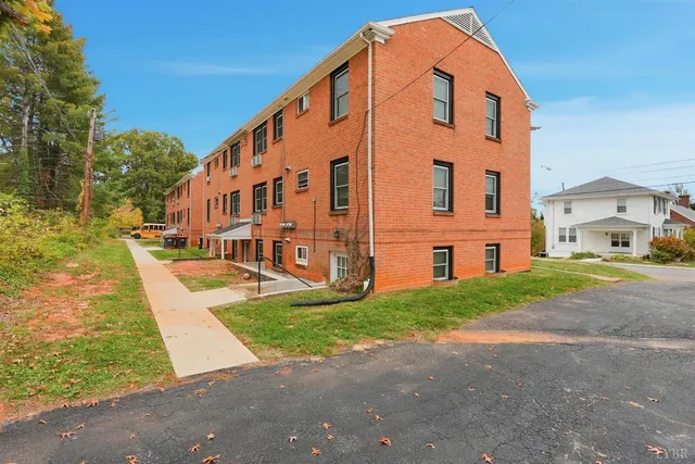 a large building with a big yard