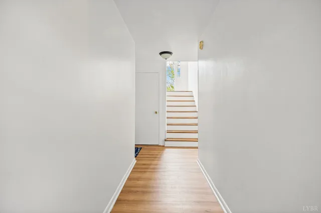 a view of a hallway with stairs