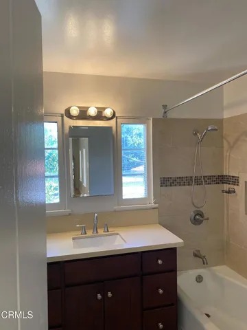 a bathroom with a sink and a bathtub
