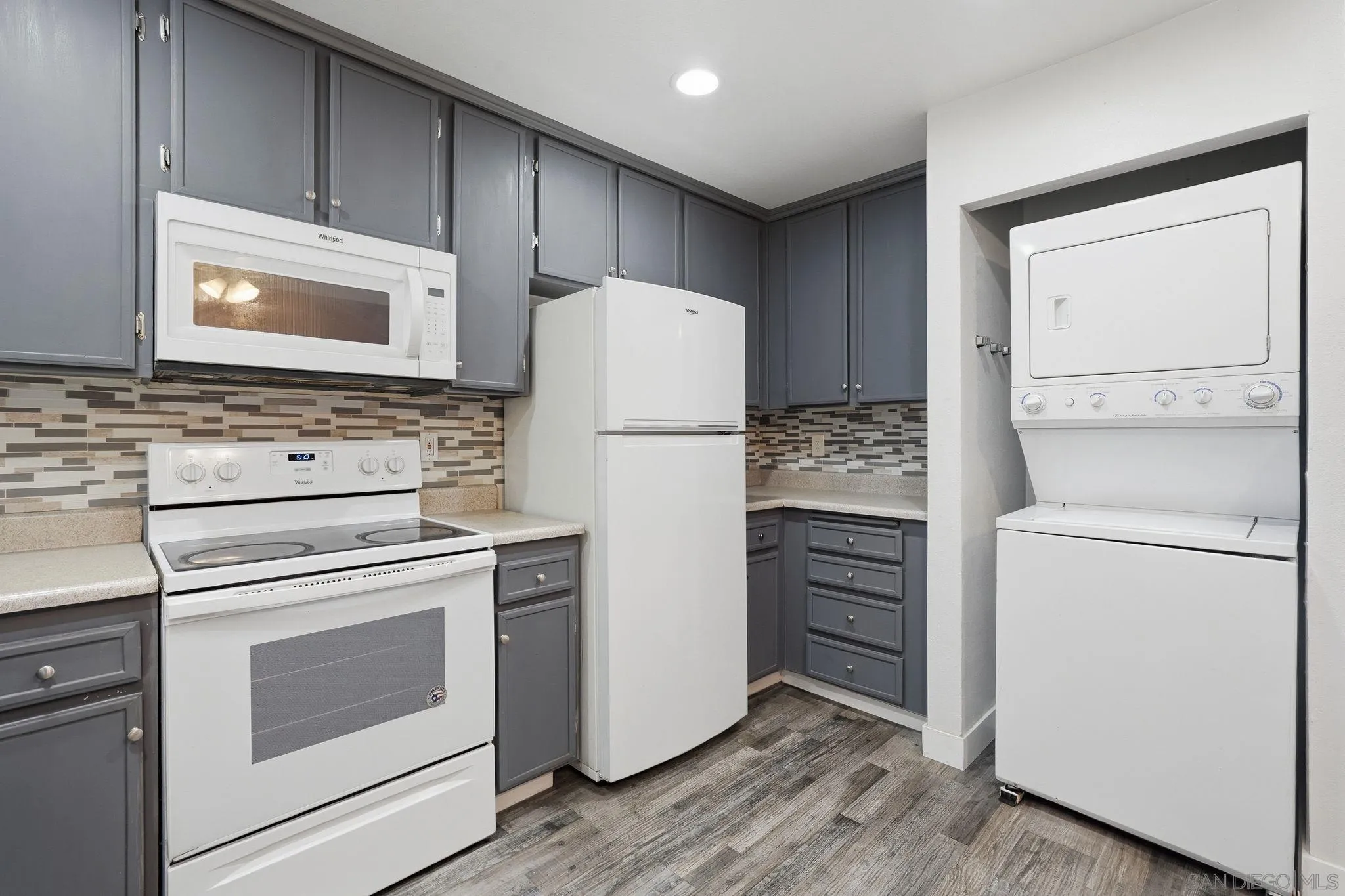 293 Sycamore Road, Unit 15 San Ysidro, CA 92173 - Photo 10 of 25 a white refrigerator freezer sitting inside of a kitchen