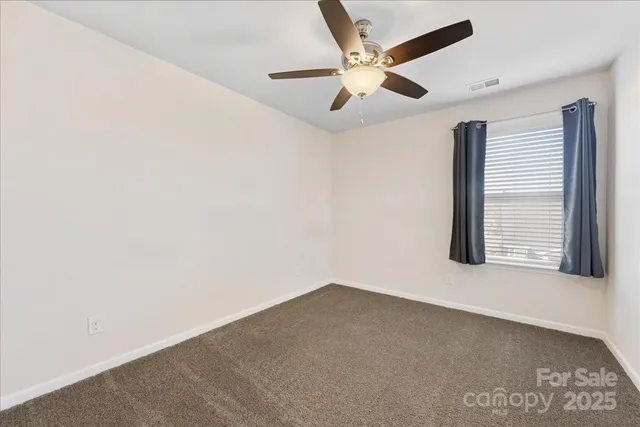 a bathroom with a sink a toilet and a shower