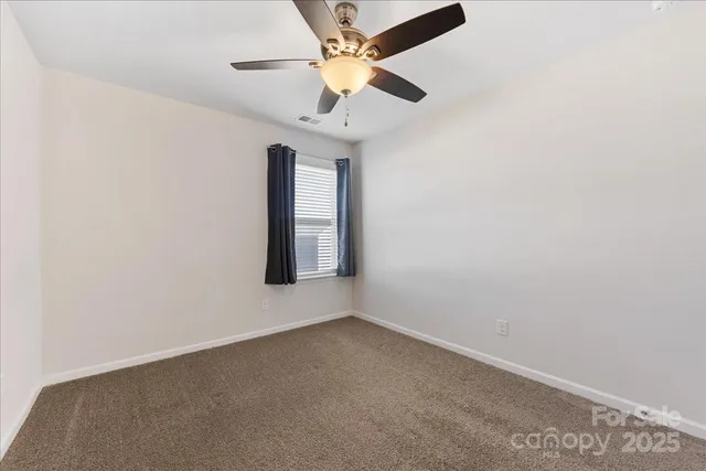 a outdoor living space with furniture potted plant and a window