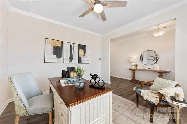 a view of a dining room with furniture and chandelier