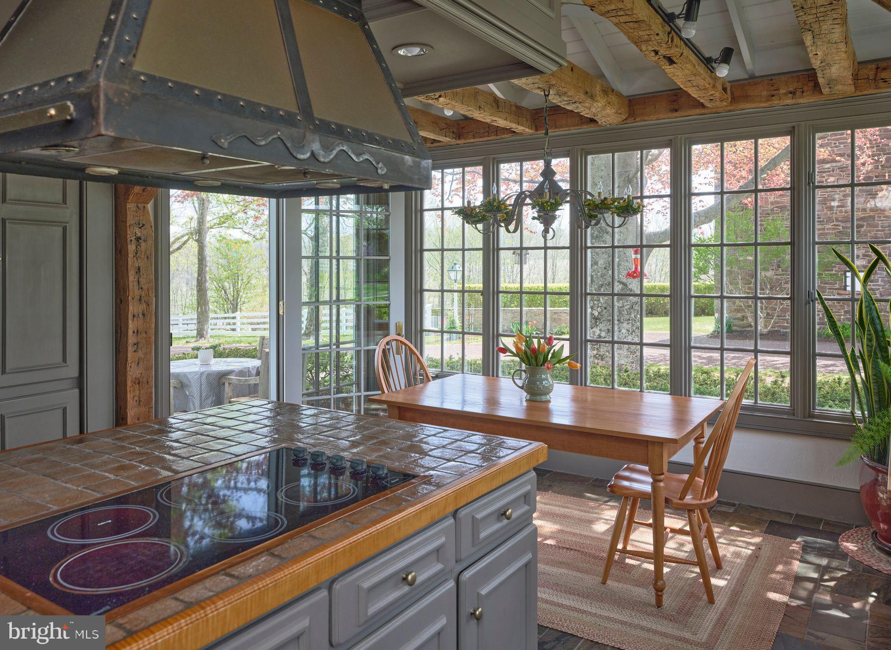 6398 Durham Road Pipersville, PA 18947 - Photo 14 of 68 a view of a dining room with furniture large windows and wooden floor