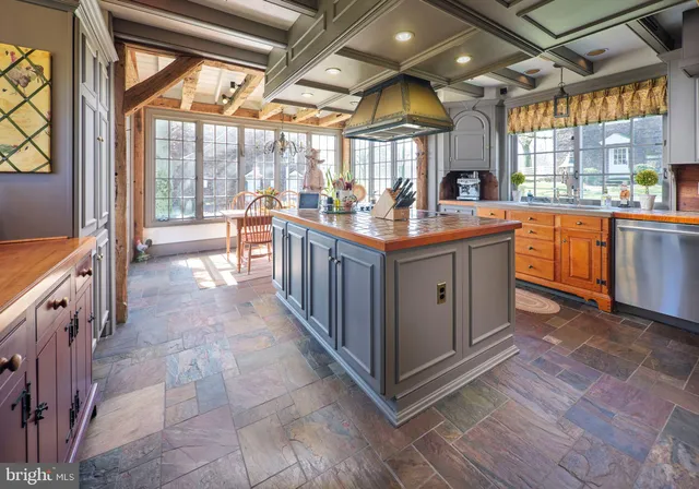 a living room with furniture rug and wooden floor