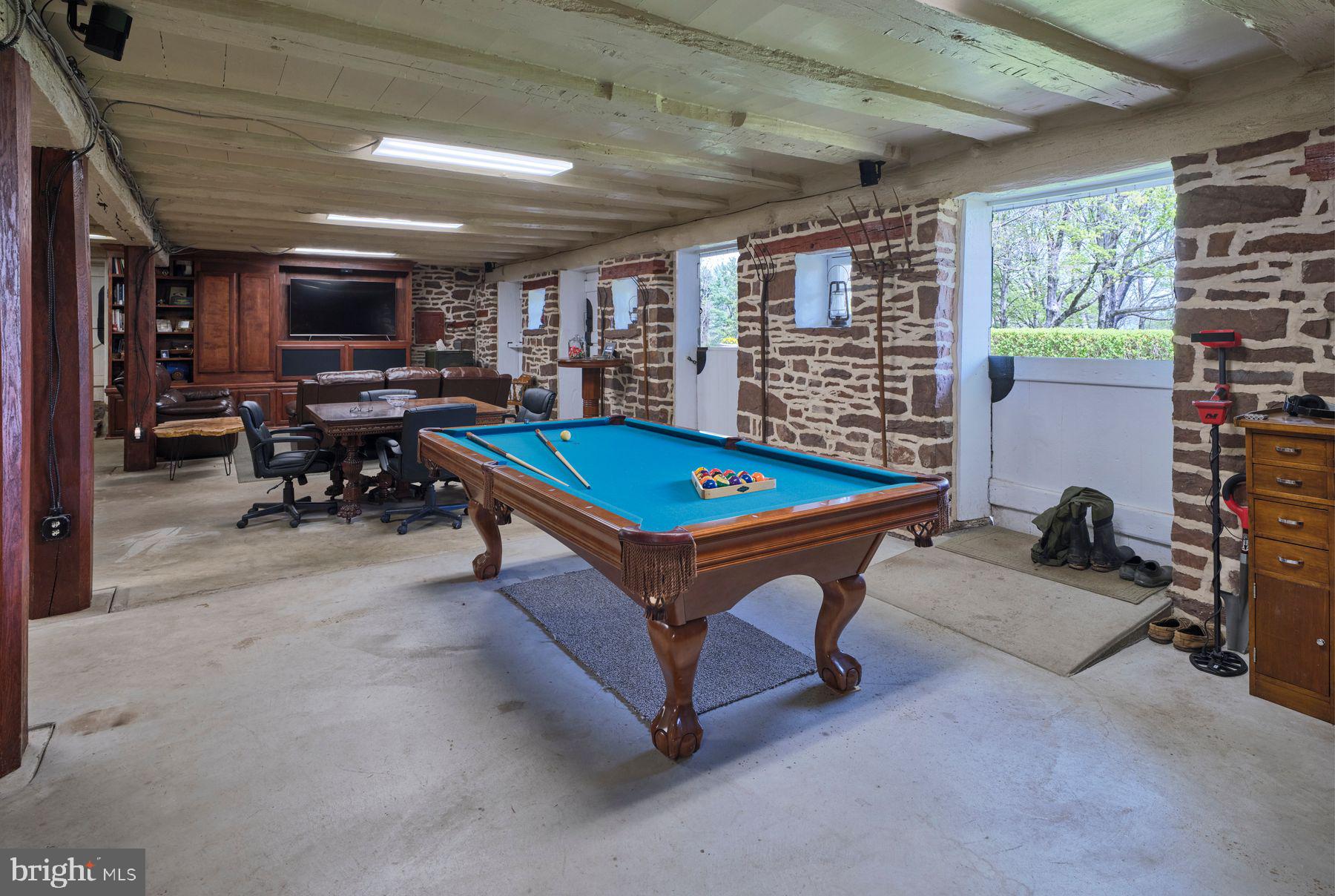 6398 Durham Road Pipersville, PA 18947 - Photo 36 of 68 a living room with furniture pool table and a flat screen tv