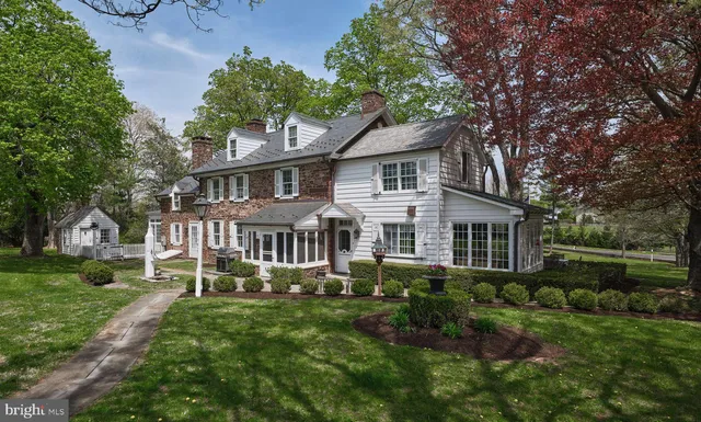 a view of backyard with seating area and green space