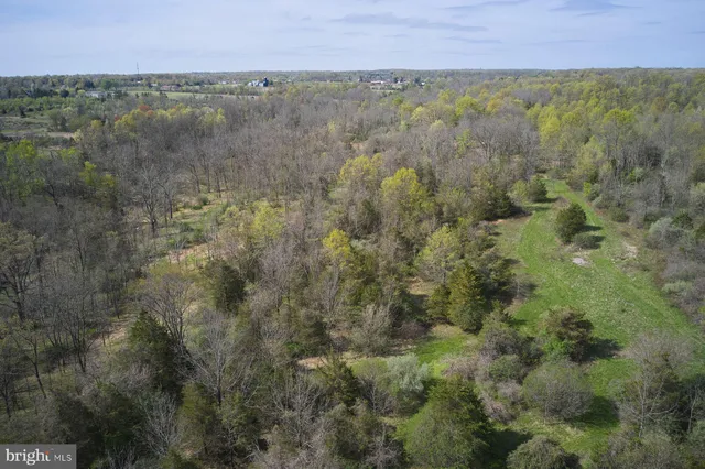 a view of a house with swimming pool and sitting area