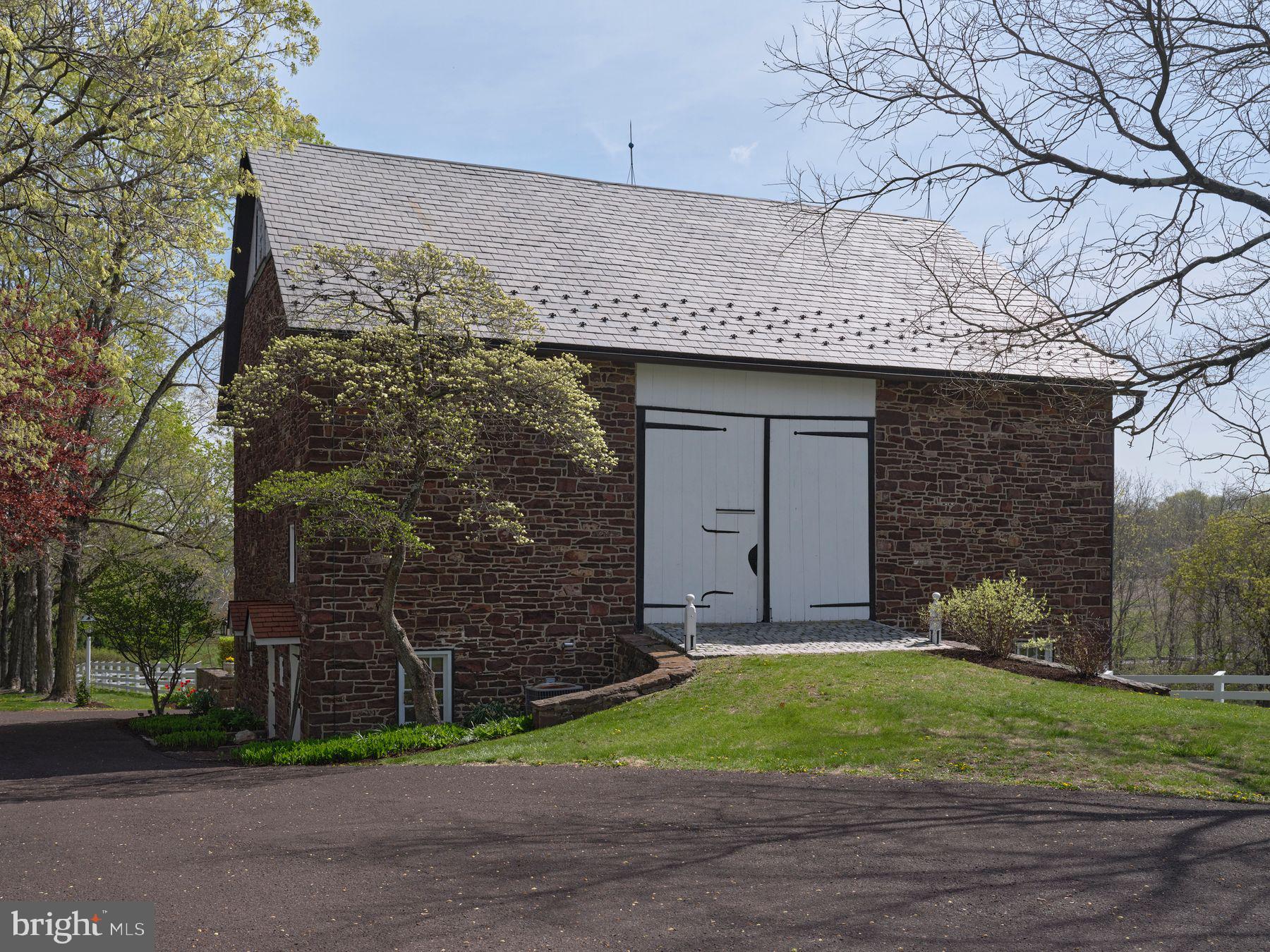 6398 Durham Road Pipersville, PA 18947 - Photo 61 of 68 a view of a house with a yard and tree s