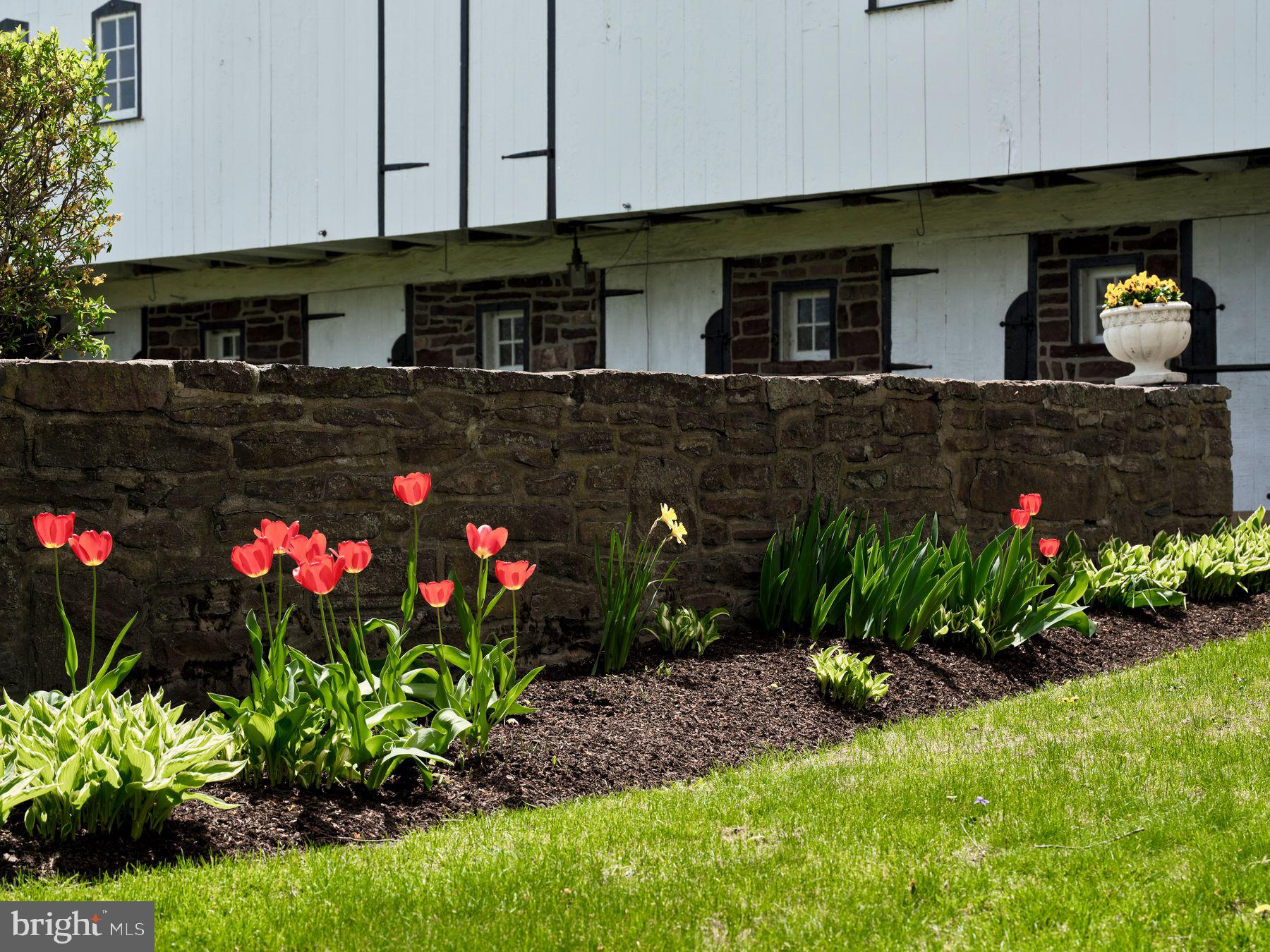6398 Durham Road Pipersville, PA 18947 - Photo 66 of 68 a bunch of flowers in front of the house