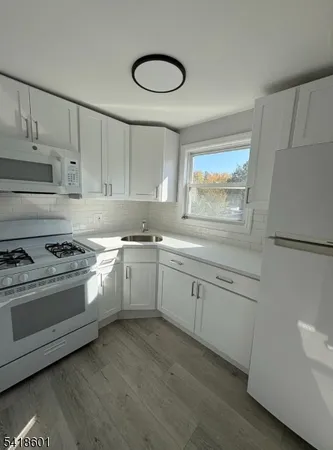 a view of front door with wooden floor