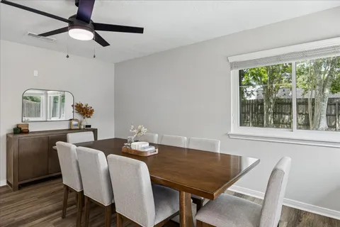 a view of a dining room with furniture window and wooden floor