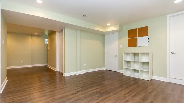 an empty room with wooden floor