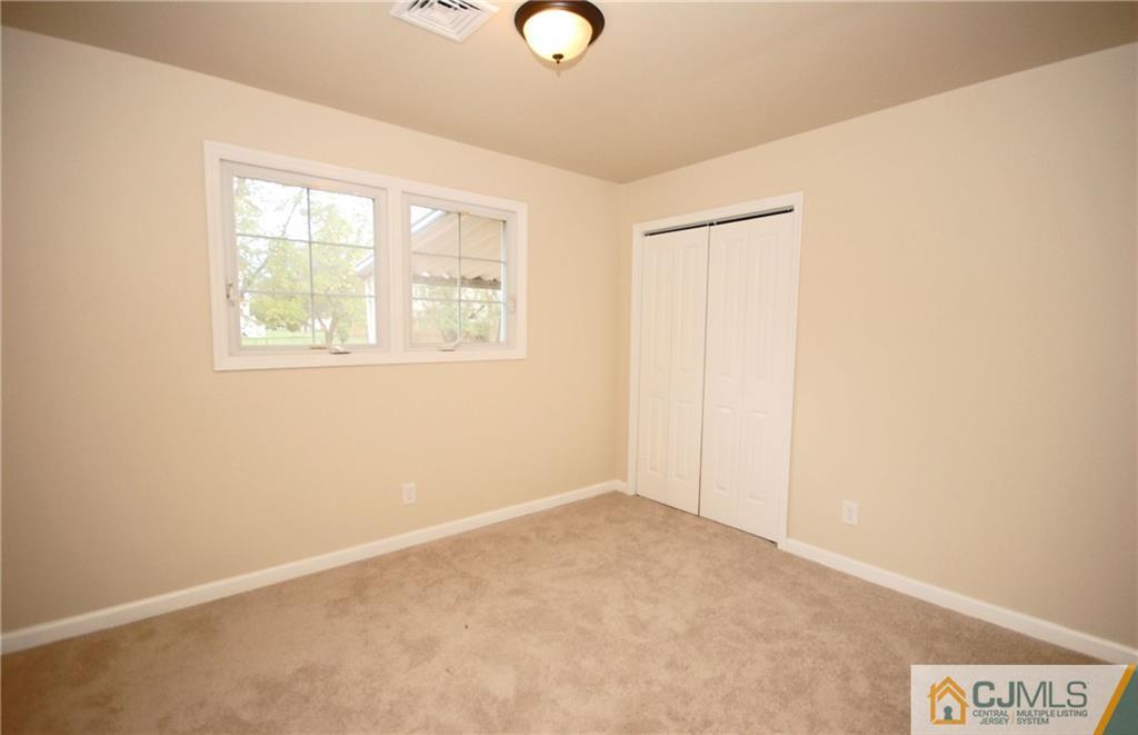 1227 Brookside Road Piscataway, NJ 08854 - Photo 14 of 22 an empty room with windows