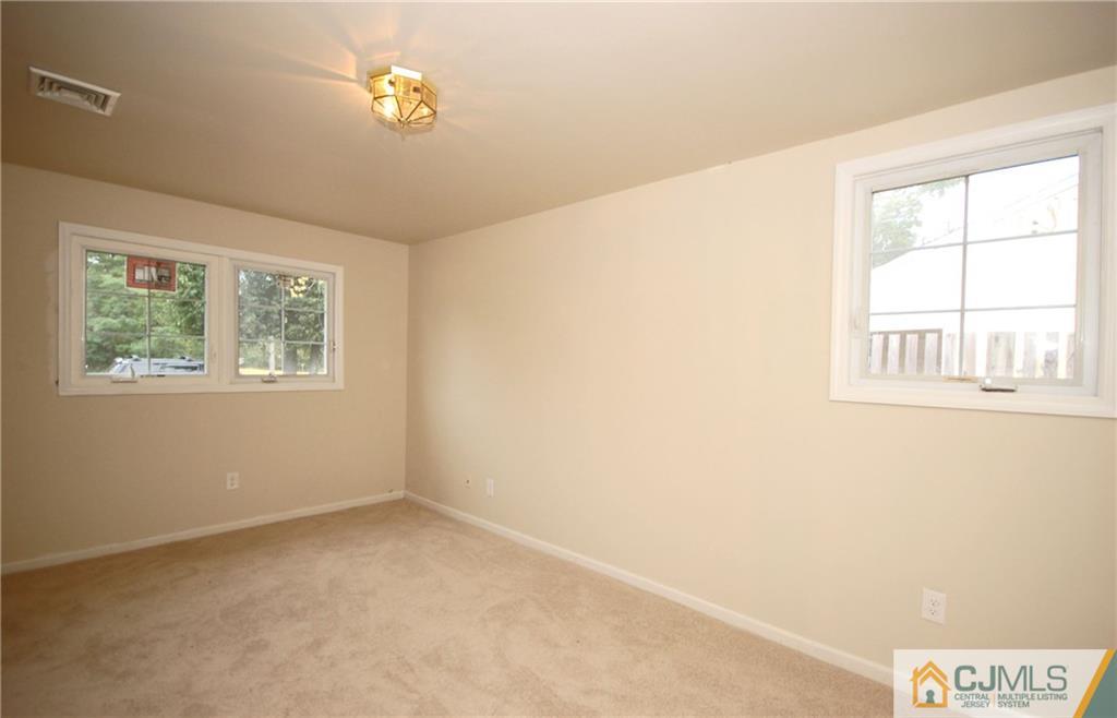 1227 Brookside Road Piscataway, NJ 08854 - Photo 15 of 22 a view of an empty room with a window