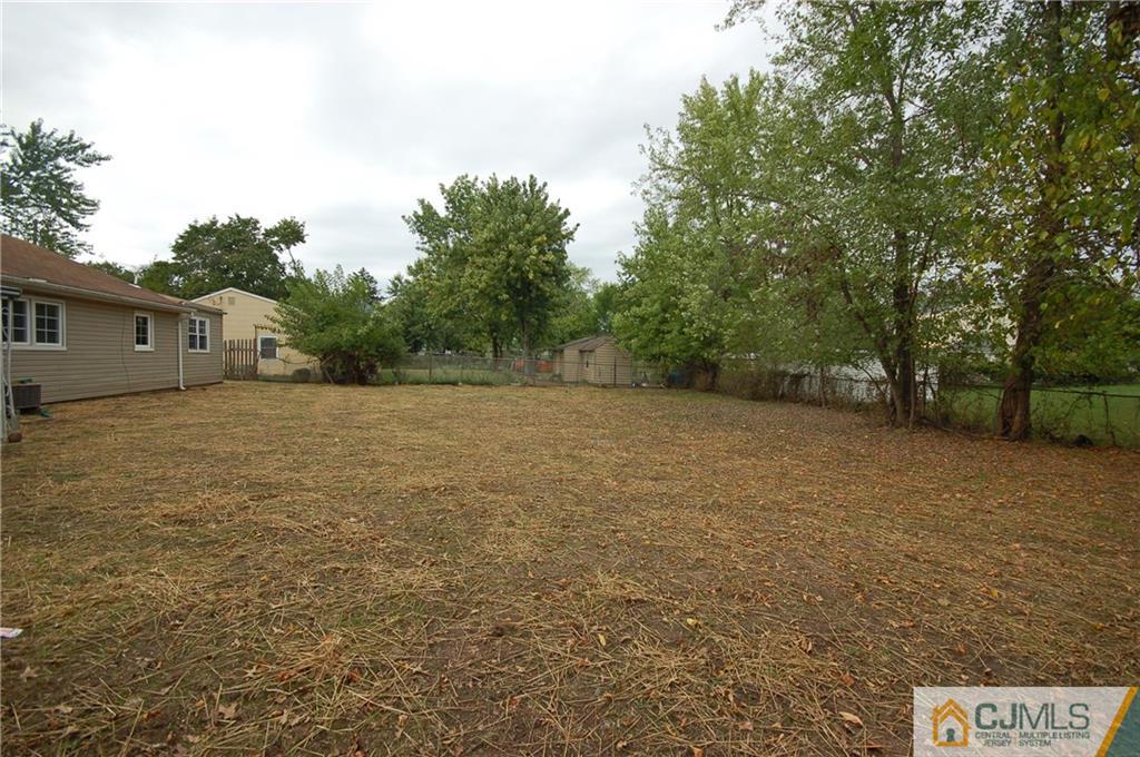 1227 Brookside Road Piscataway, NJ 08854 - Photo 21 of 22 a view of a field with trees in front of it