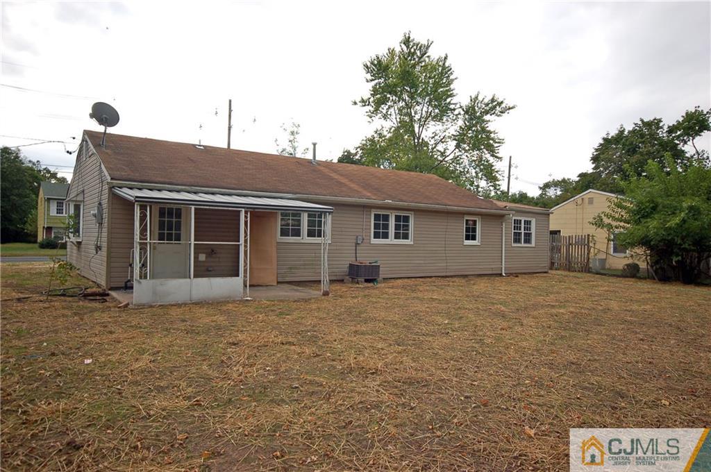 1227 Brookside Road Piscataway, NJ 08854 - Photo 22 of 22 a front view of a house with a garden