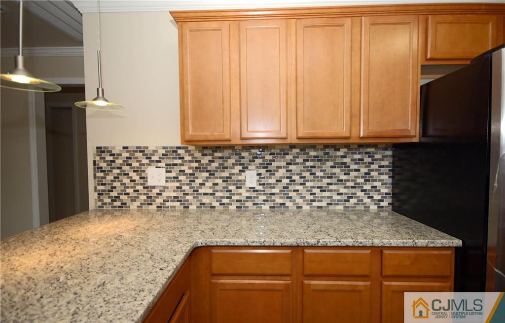 1227 Brookside Road Piscataway, NJ 08854 - Photo 7 of 22 a bathroom with a granite countertop sink and a mirror