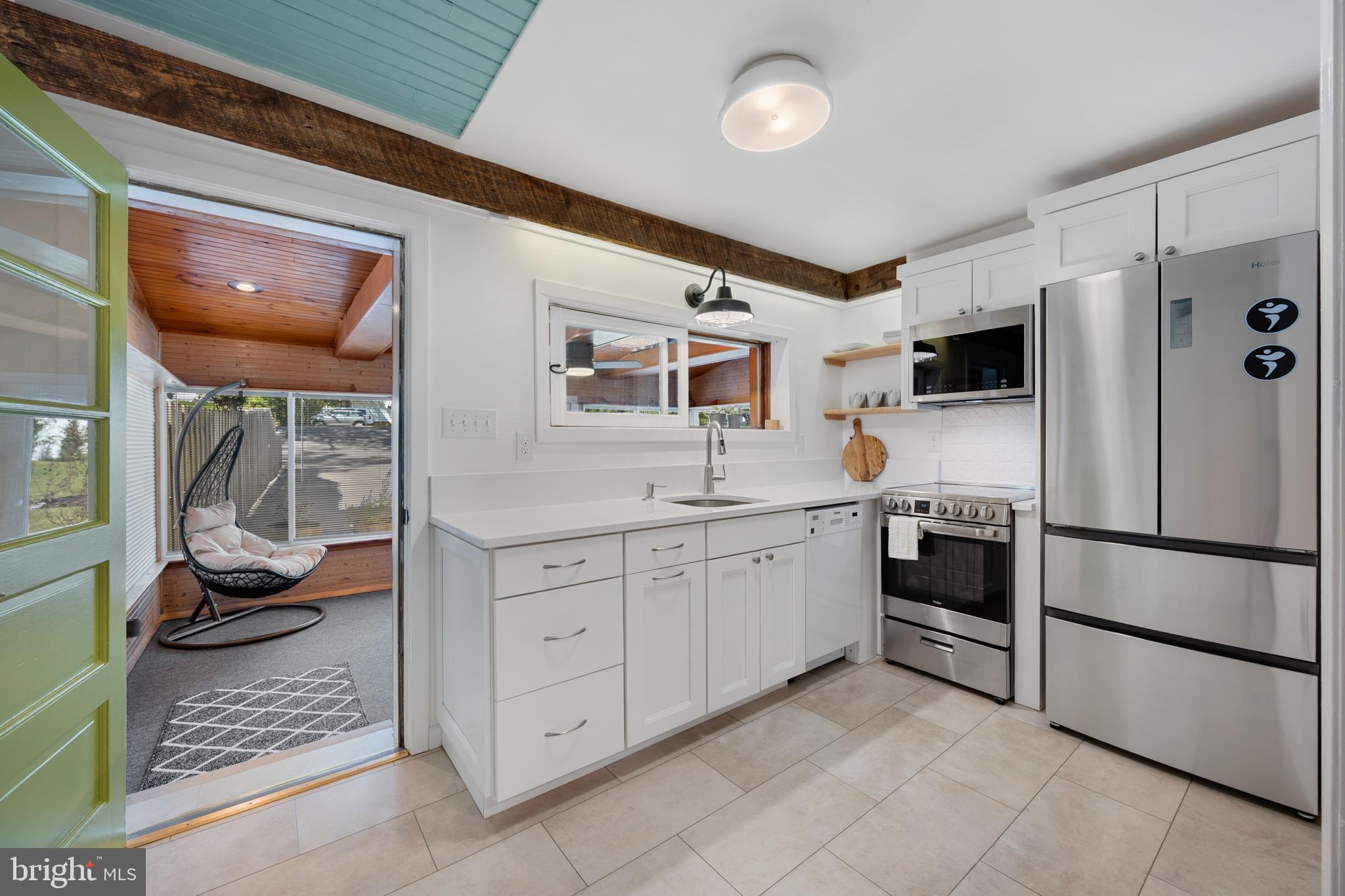 361 East Butler Avenue Ambler, PA 19002 - Photo 14 of 39 a kitchen with stainless steel appliances granite countertop a refrigerator and a sink