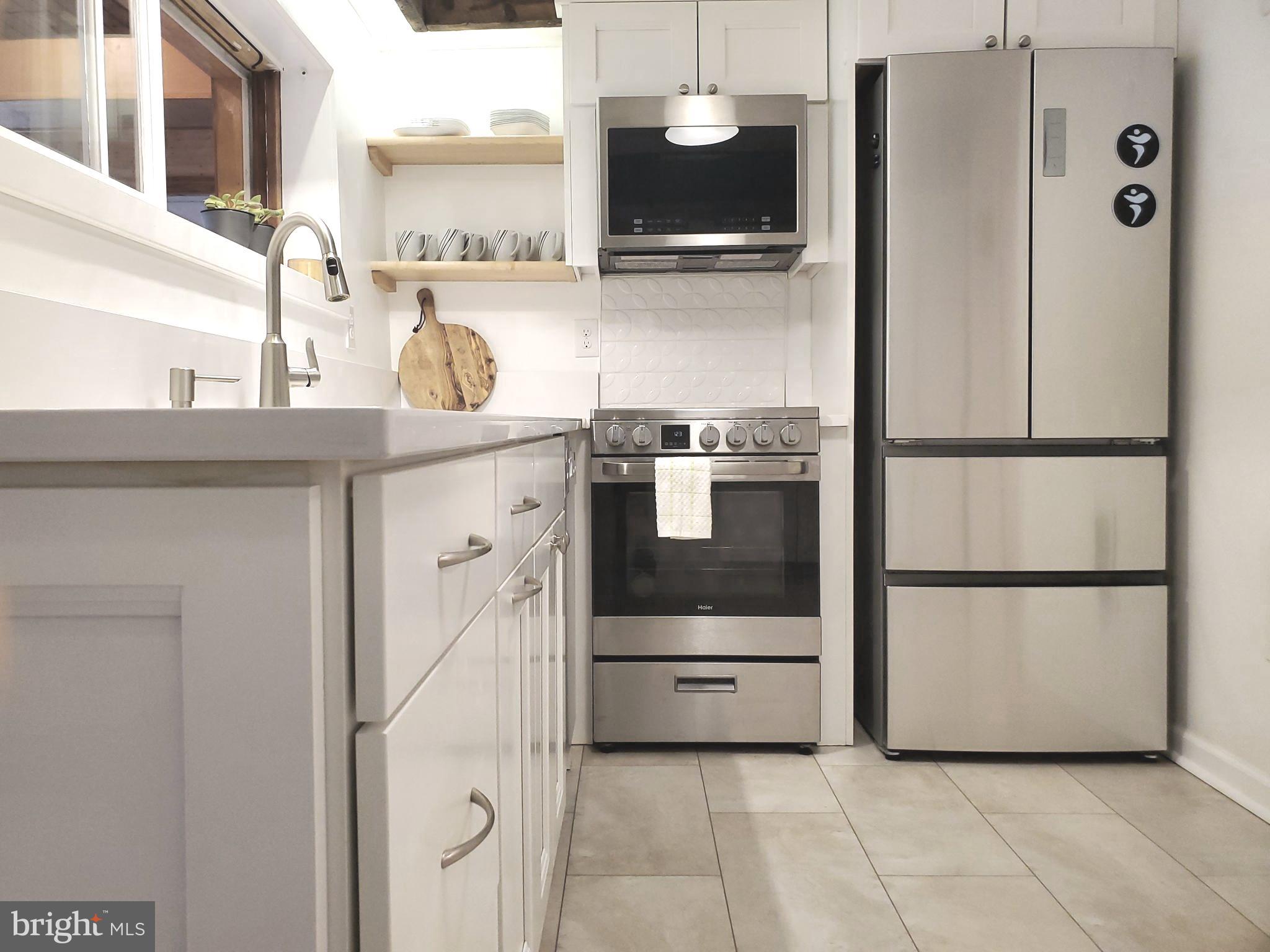 361 East Butler Avenue Ambler, PA 19002 - Photo 15 of 39 a kitchen with stainless steel appliances a refrigerator and cabinets