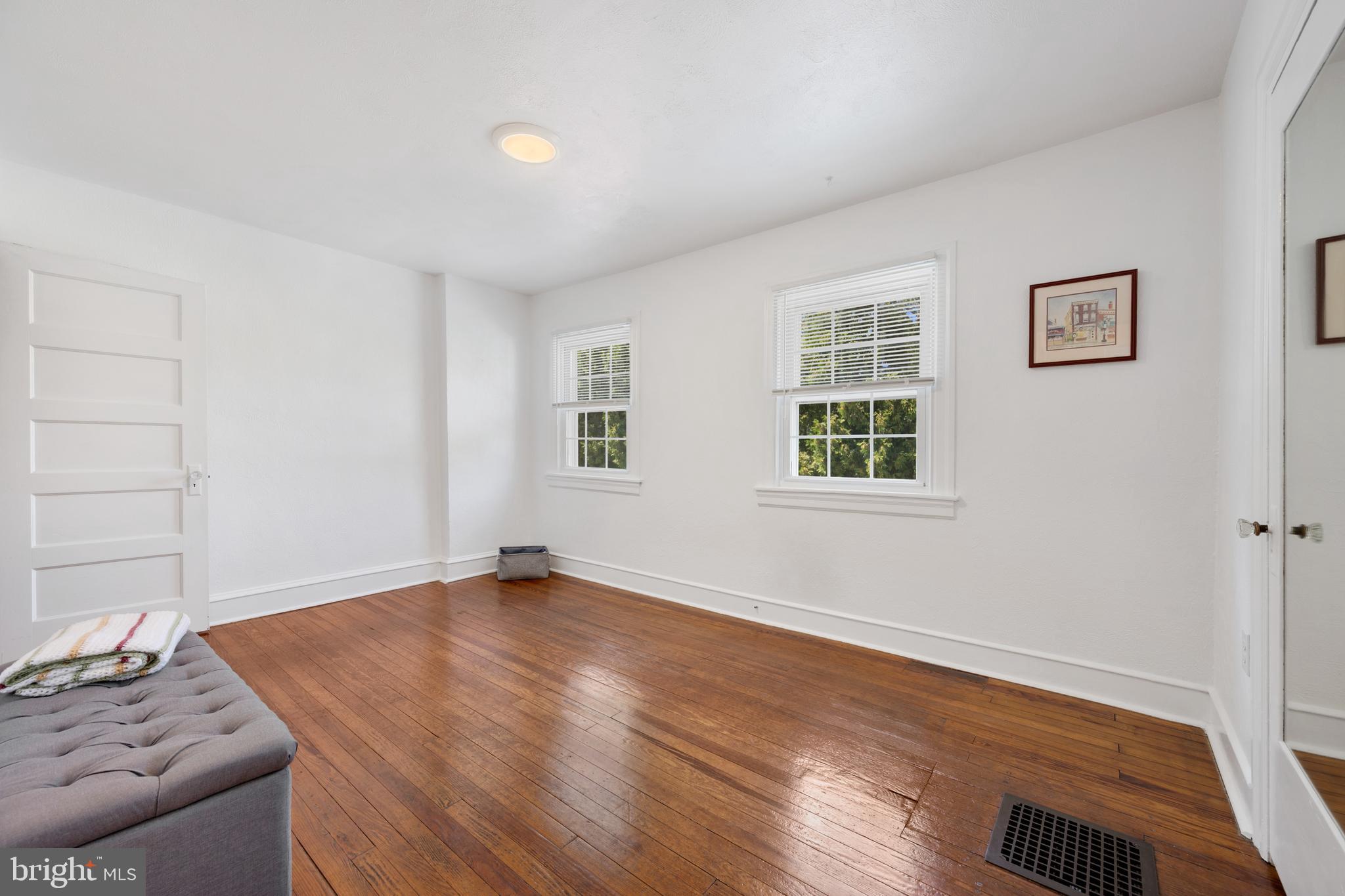 361 East Butler Avenue Ambler, PA 19002 - Photo 24 of 39 a view of an empty room with window and wooden floor
