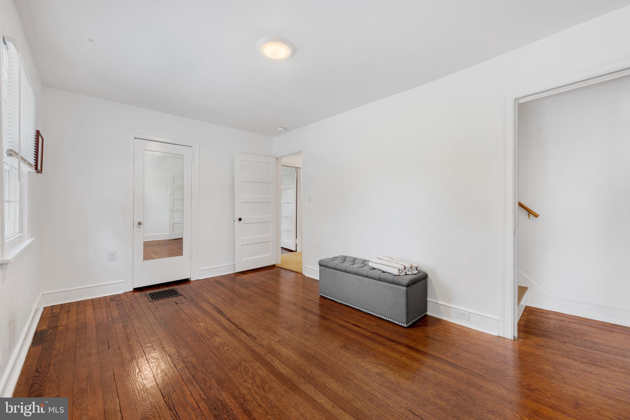 361 East Butler Avenue Ambler, PA 19002 - Photo 25 of 39 an empty room with wooden floor and natural light
