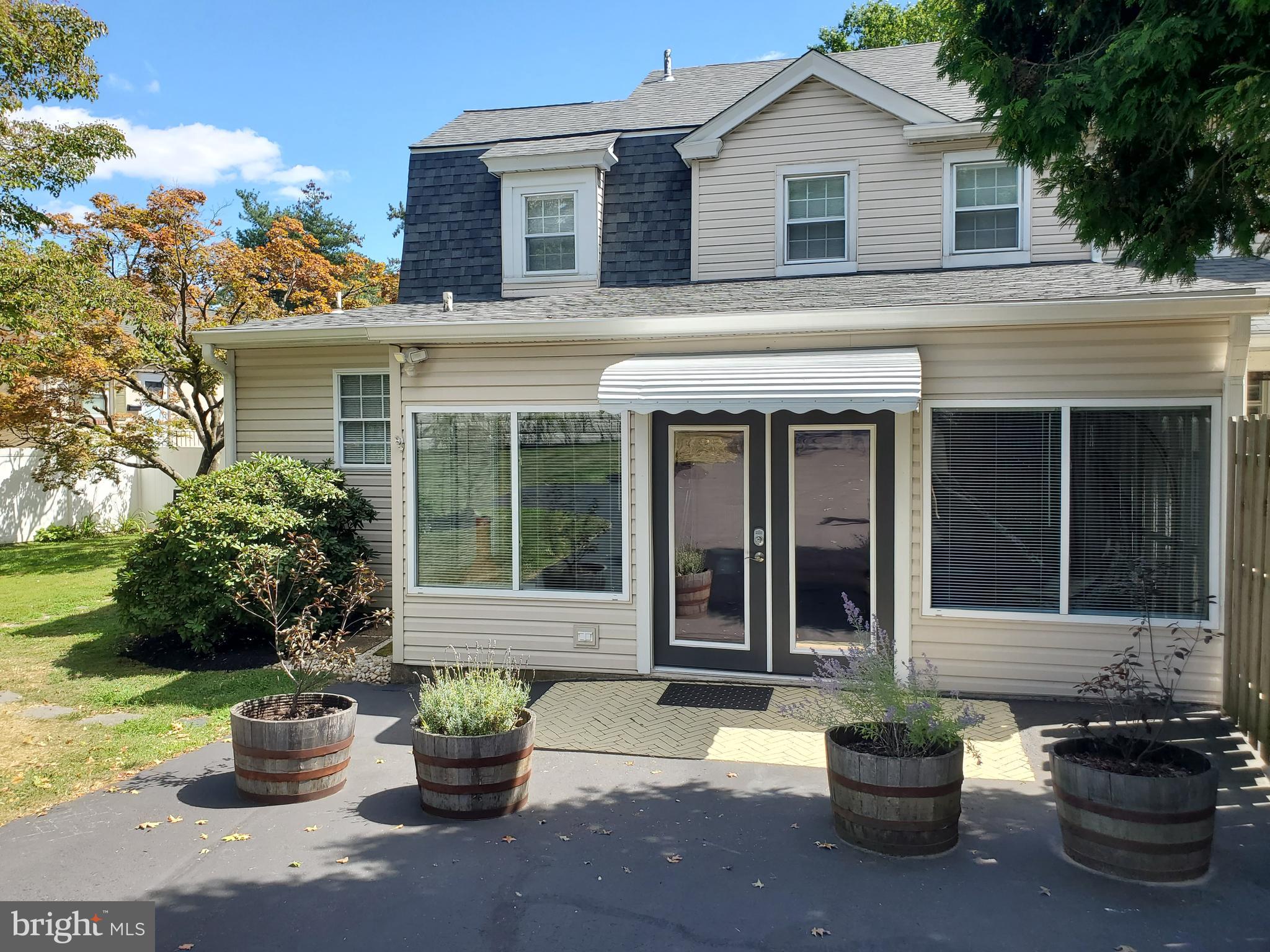 361 East Butler Avenue Ambler, PA 19002 - Photo 33 of 39 a view of a white house with potted plants and a potted plant