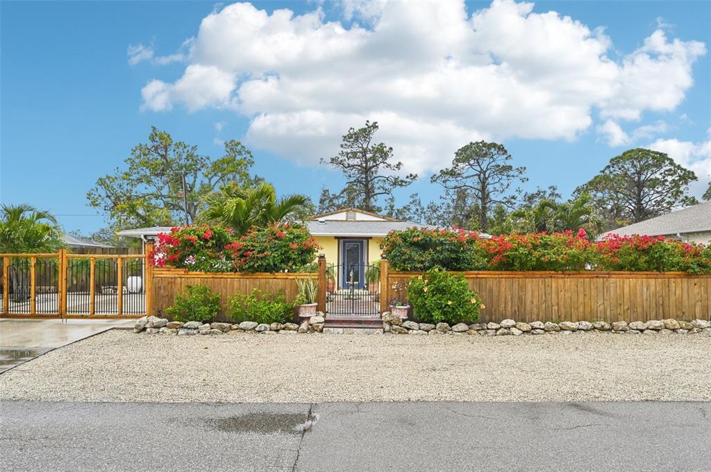 5780 Elton Road Venice, FL 34293 - Photo 1 of 1 a front view of a house with garden