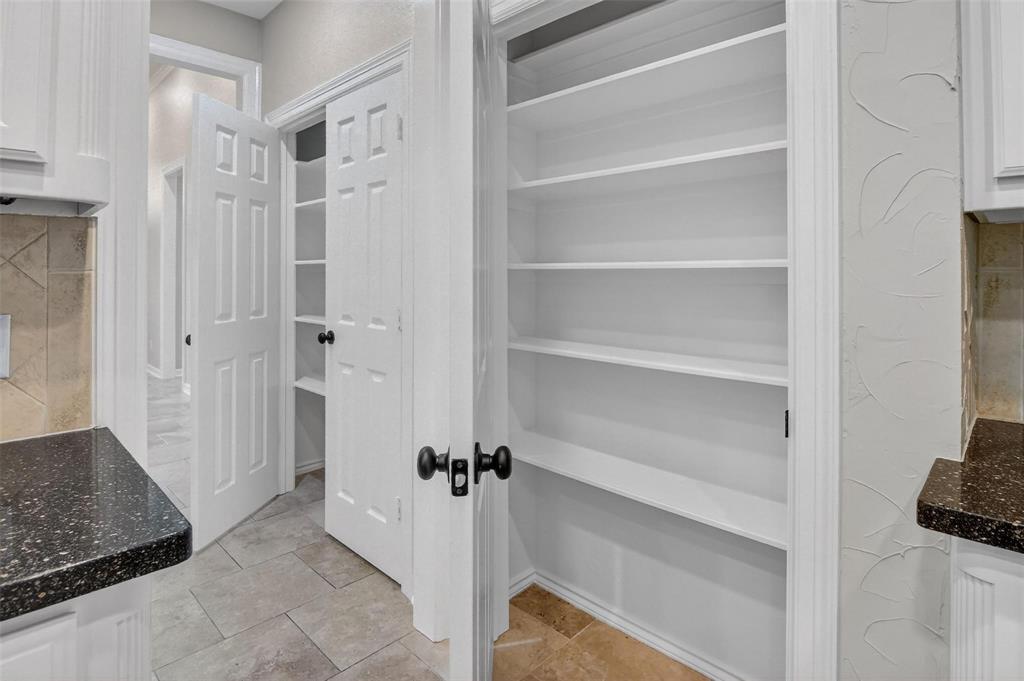 2122 Clear Lake Road Weatherford, TX 76087 - Photo 6 of 31 a view of a hallway with closet and a window
