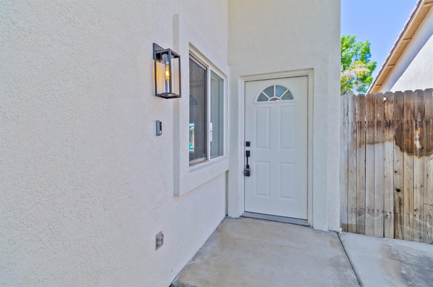 7110 Firebaugh Street Bakersfield, CA 93313 - Photo 24 of 37 a view of an entryway with wooden floor