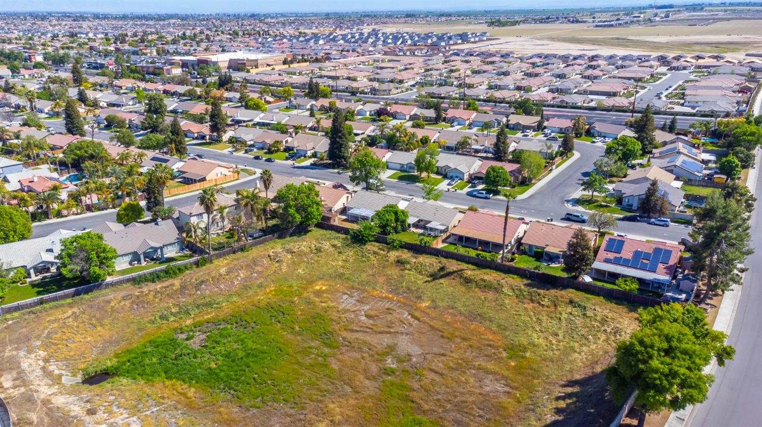 7110 Firebaugh Street Bakersfield, CA 93313 - Photo 27 of 37 an aerial view of residential houses with outdoor space
