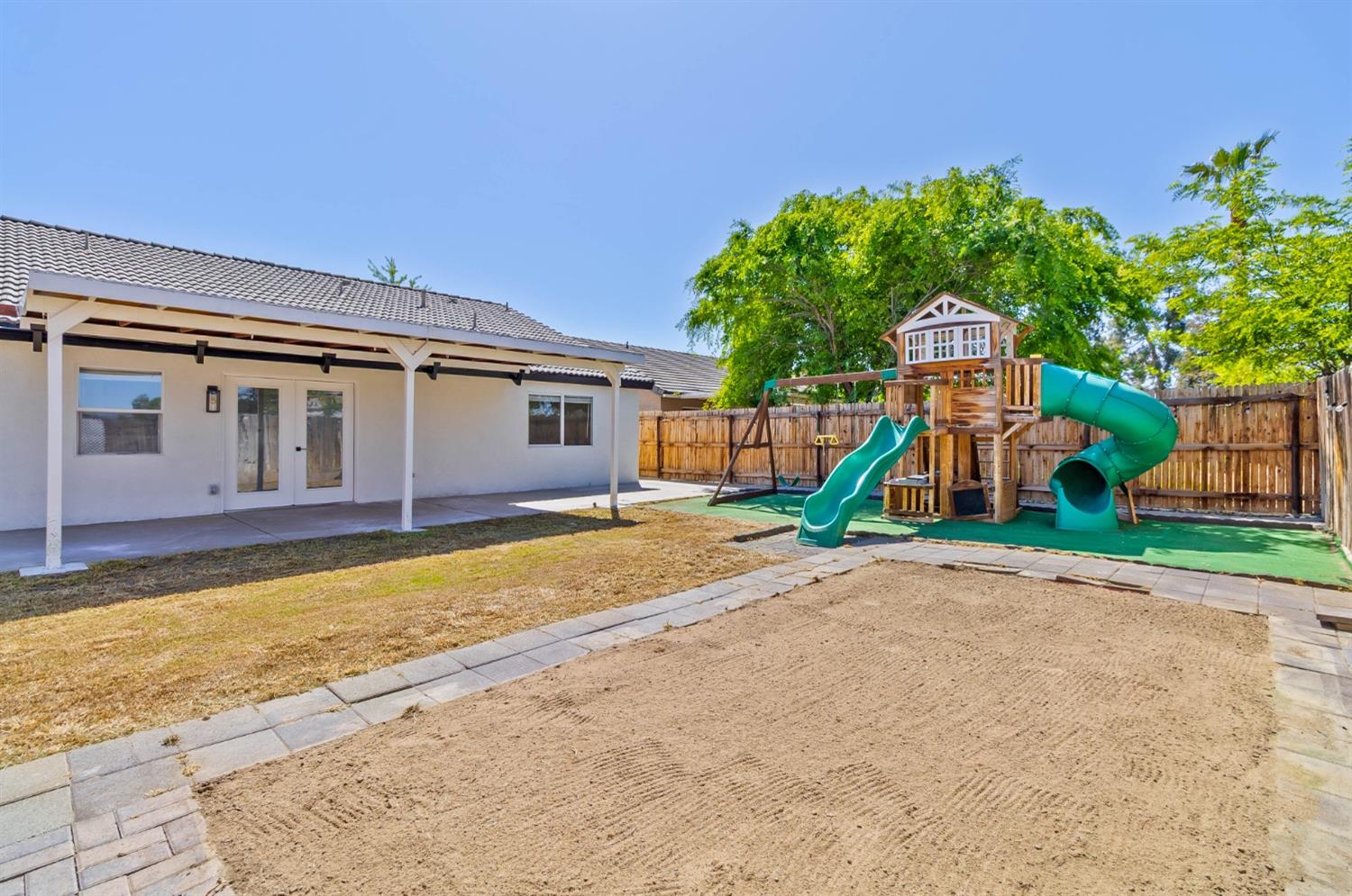 7110 Firebaugh Street Bakersfield, CA 93313 - Photo 35 of 37 a front view of a house with a yard