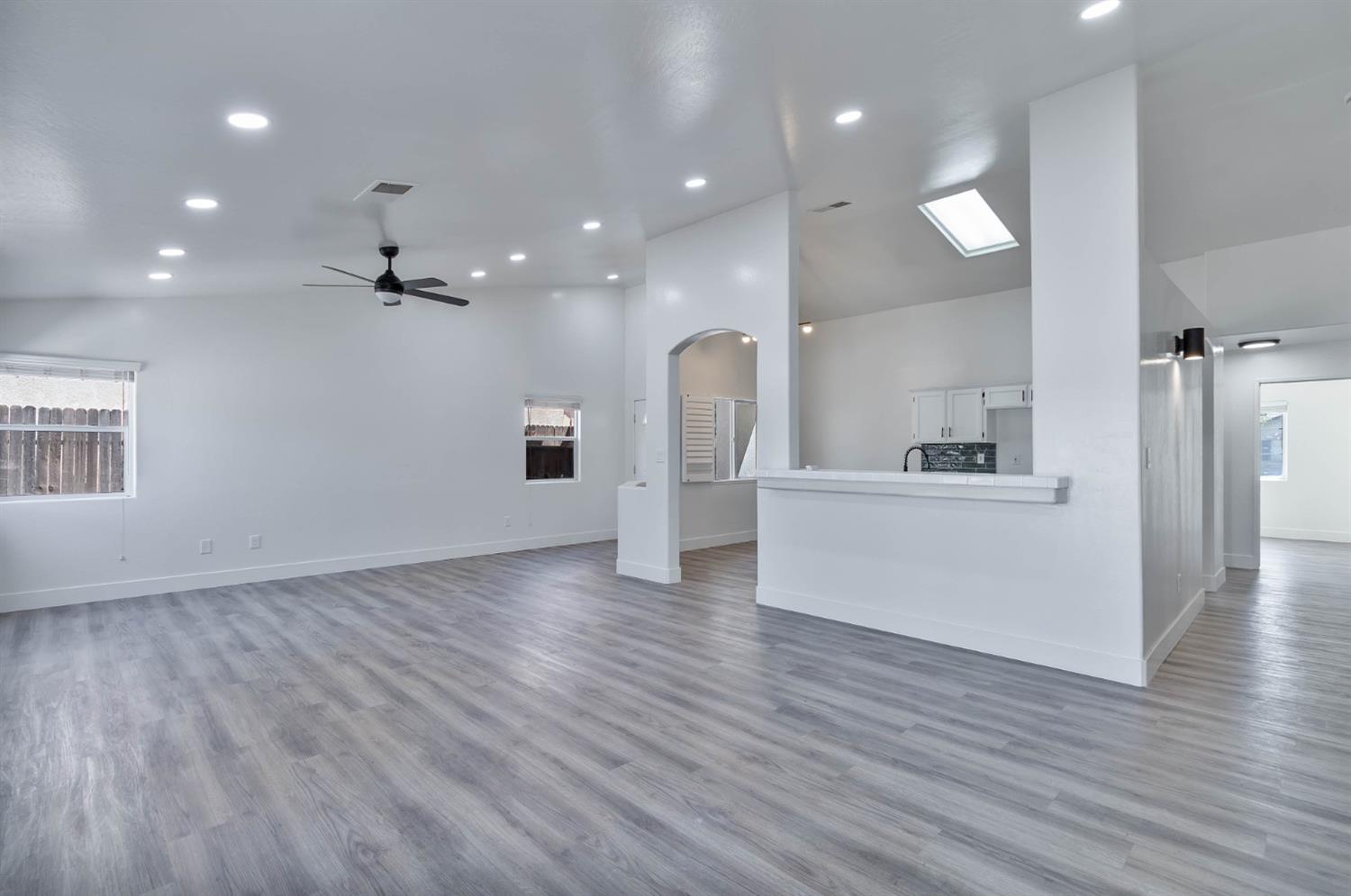 7110 Firebaugh Street Bakersfield, CA 93313 - Photo 4 of 37 a view of a kitchen with a sink and a refrigerator