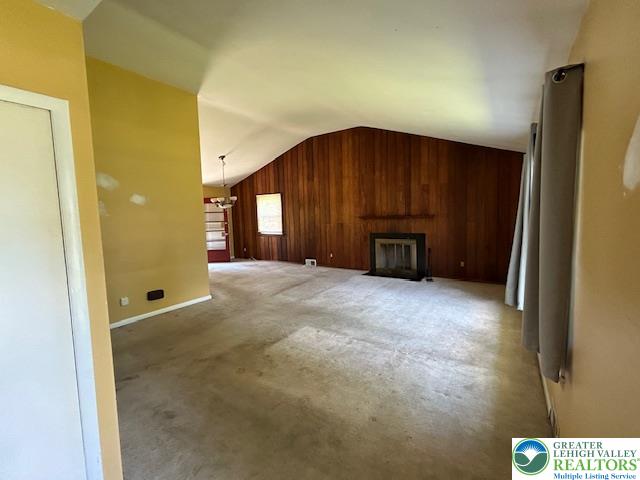 2065 Hopewell Road Bethlehem, PA 18017 - Photo 2 of 19 A spacious living area with vaulted ceilings and a warm wood burning fireplace creates an inviting atmosphere.