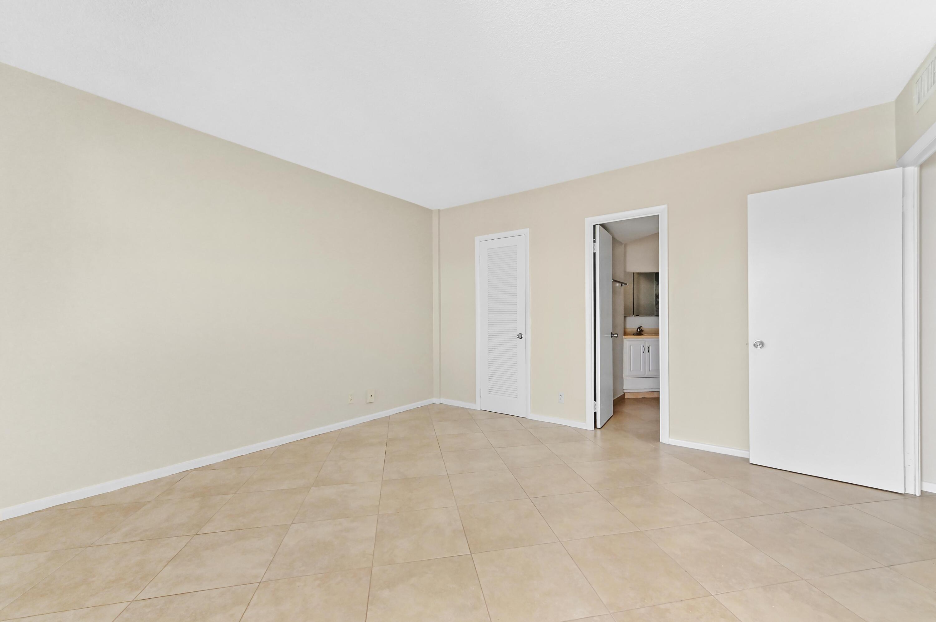 710 North Ocean Boulevard, Unit 710 Pompano Beach, FL 33062 - Photo 24 of 42 a view of an empty room and closet area