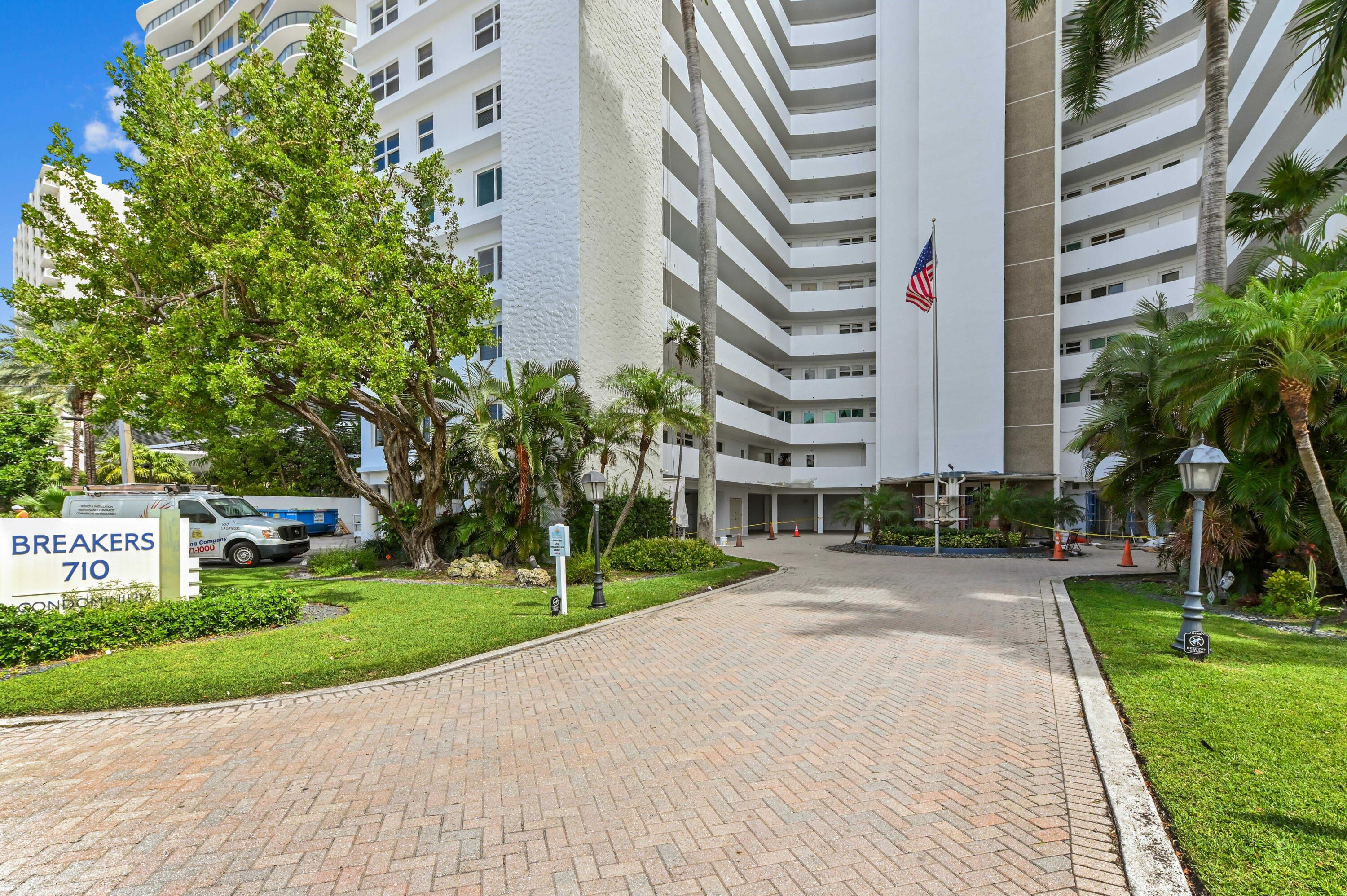 710 North Ocean Boulevard, Unit 710 Pompano Beach, FL 33062 - Photo 3 of 42 a view of a buildings with a yard