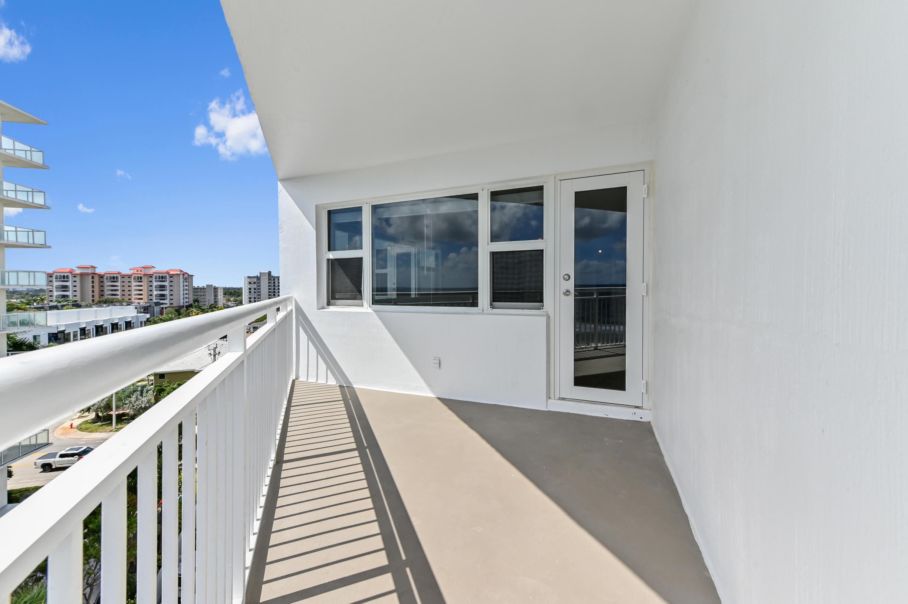 710 North Ocean Boulevard, Unit 710 Pompano Beach, FL 33062 - Photo 31 of 42 a view of balcony with wooden floor and fence