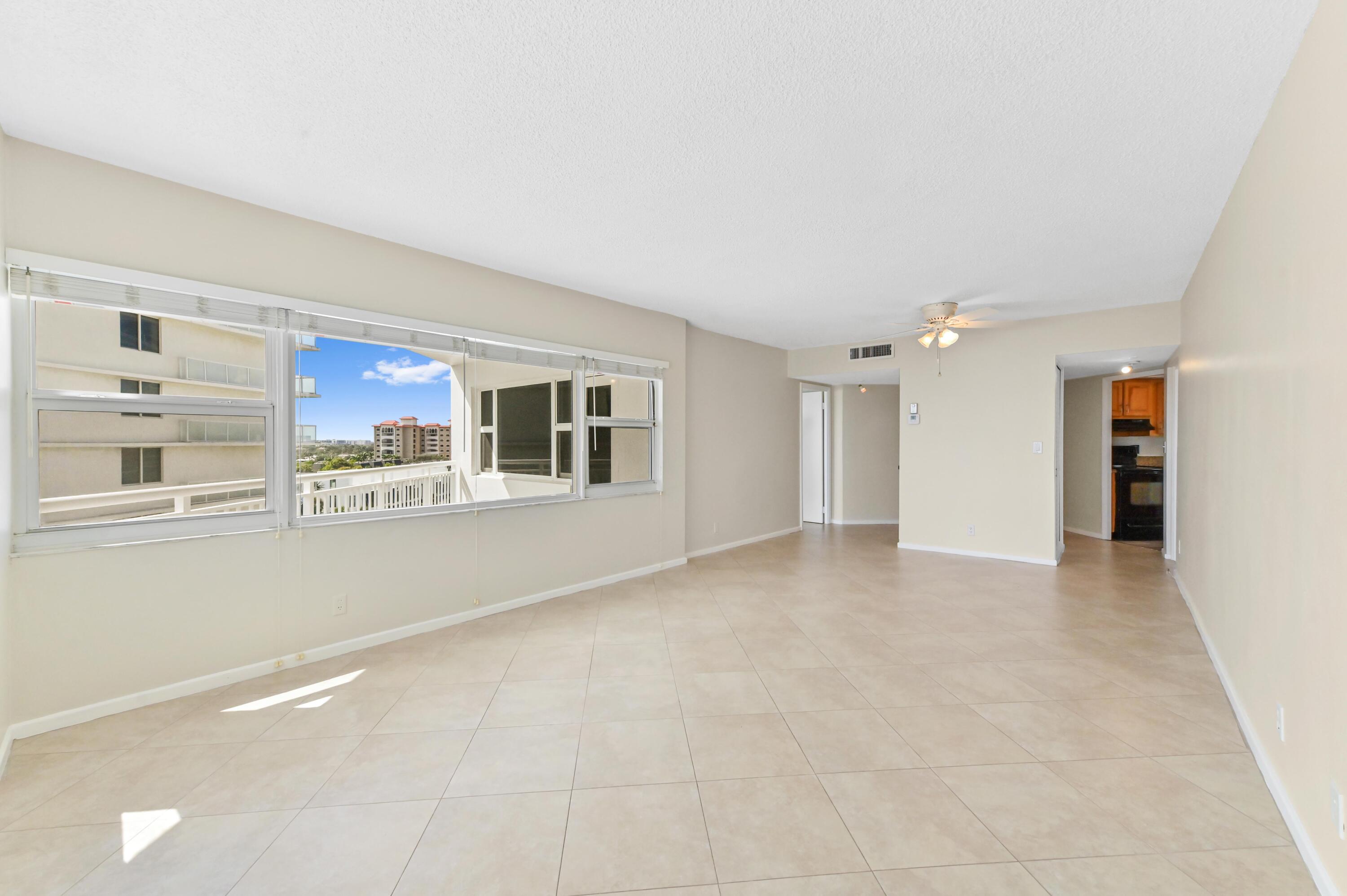 710 North Ocean Boulevard, Unit 710 Pompano Beach, FL 33062 - Photo 9 of 42 a view of a livingroom with an empty space and a window