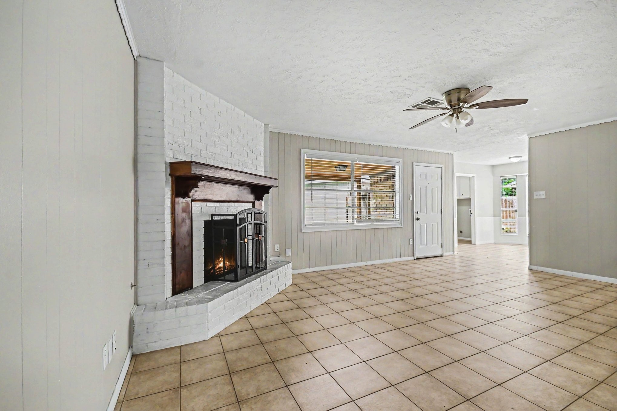 4306 Oneida Street Pasadena, TX 77504 - Photo 6 of 23 a view of a livingroom with a fireplace and window