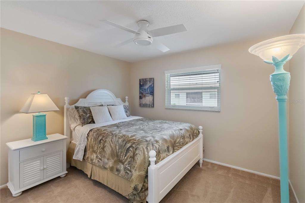 2240 Stickney Point Road, Unit 238 Sarasota, FL 34231 - Photo 8 of 17 a bed room with a bed and a window