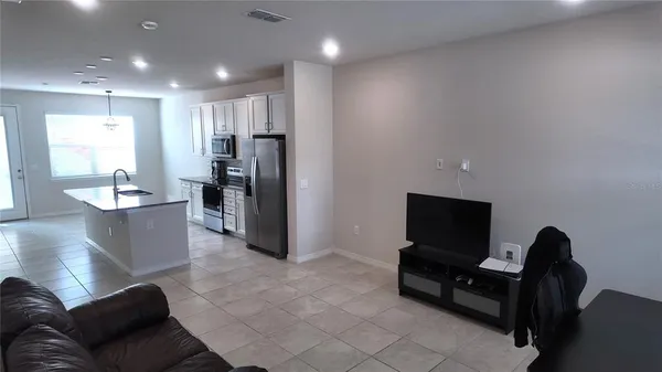 a living room with furniture and a flat screen tv