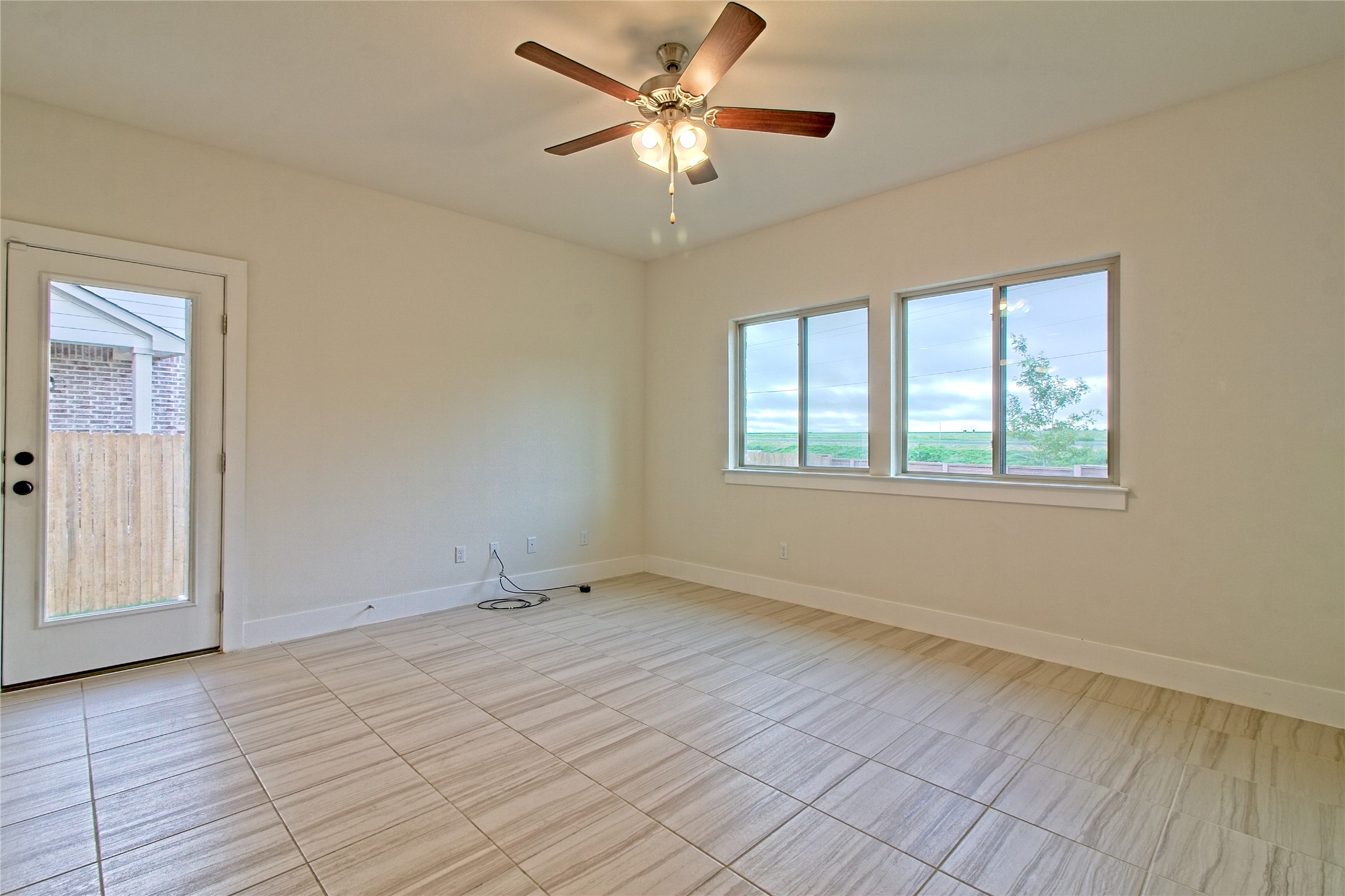 555 White Steppe Way Georgetown, TX 78626 - Photo 14 of 40 wooden floor in an empty room with a window