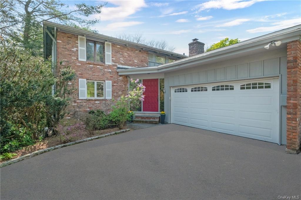 Lovely brick contemporary set on a private, oversized lot.